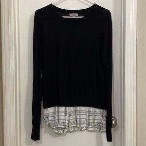 Black sweater with layered plaid button down look